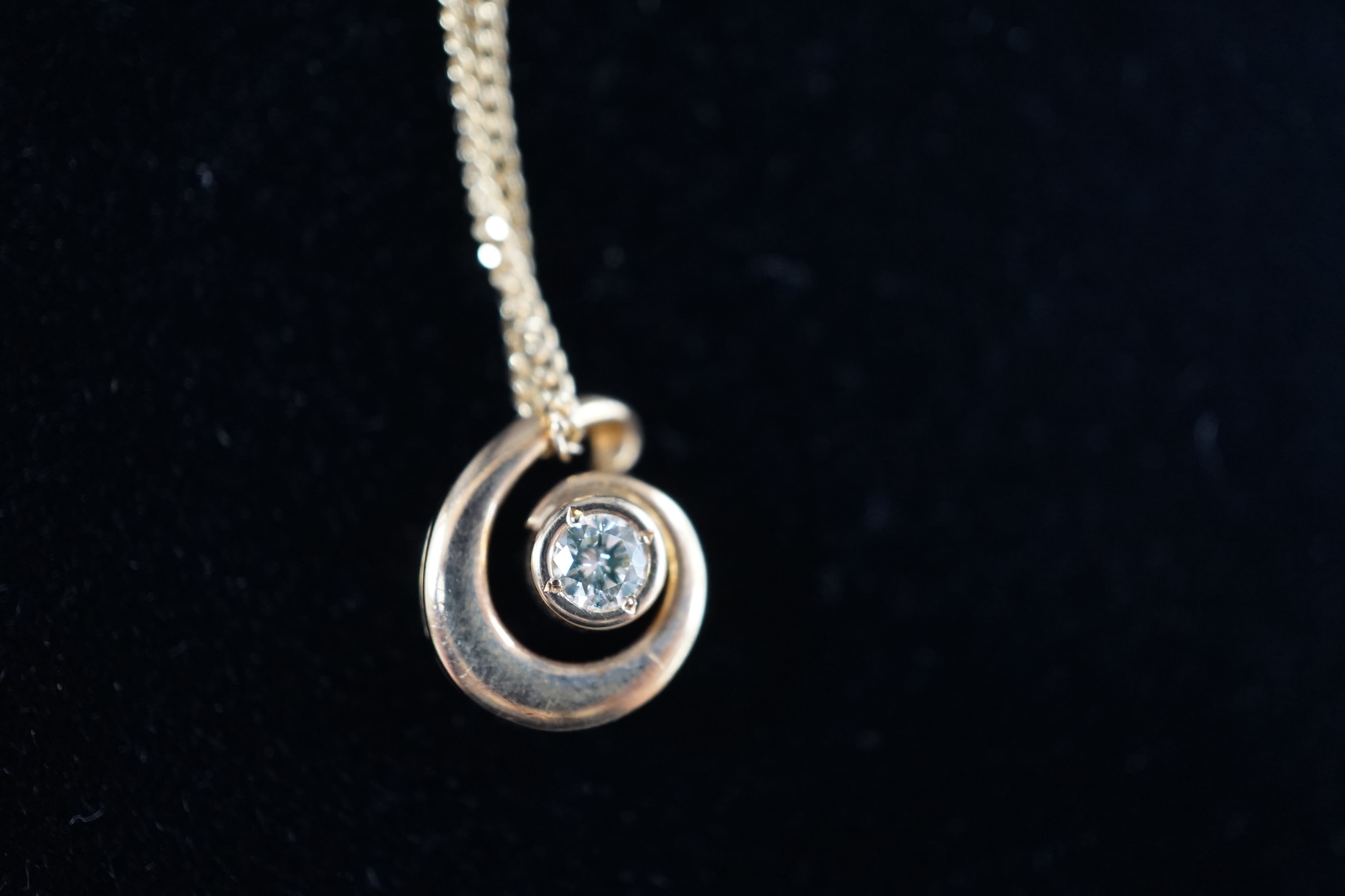 A modern yellow and white metal (stamped 18kt and Pt850), graduated three stone diamond set pendant necklace, 42cm, gross weight 7.1 grams and a an Italian Uno-A-Erre 18ct gold and solitaire diamond set necklace, 46cm, g